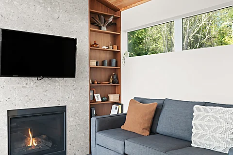 Cozy living room with a gas fireplace and built-in shelving