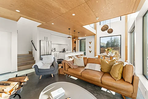 Sunshine Coast living room with warm timber ceilings and an open layout