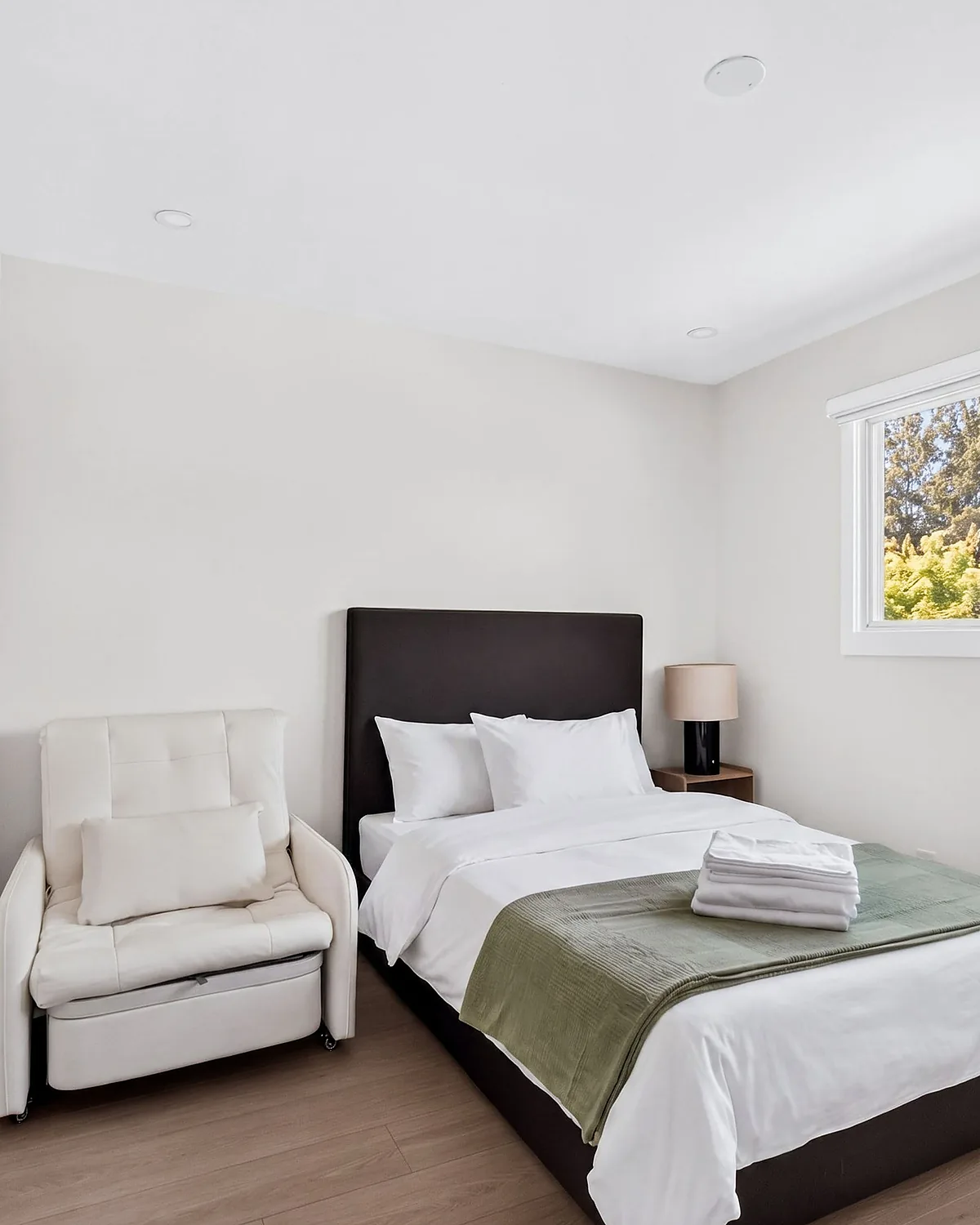 Vertical frame of a guest bedroom, cropped for the Airbnb app