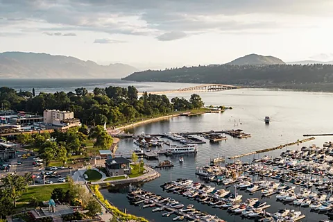 Aerial over a marina and shoreline at golden hour