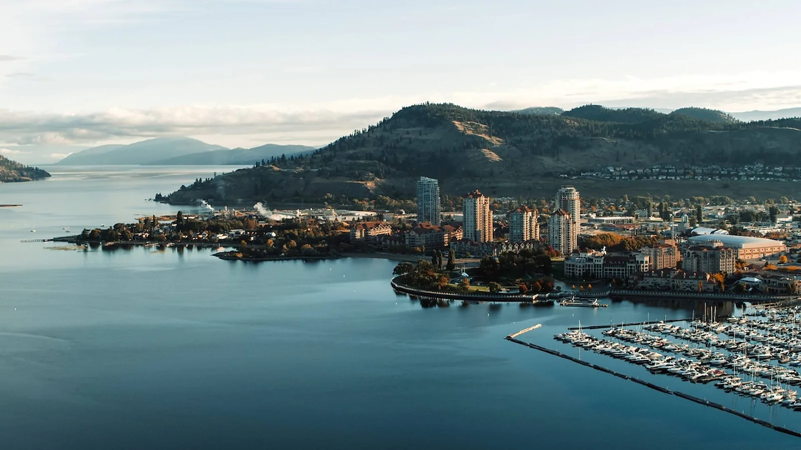 Aerial over a waterfront town and its marina