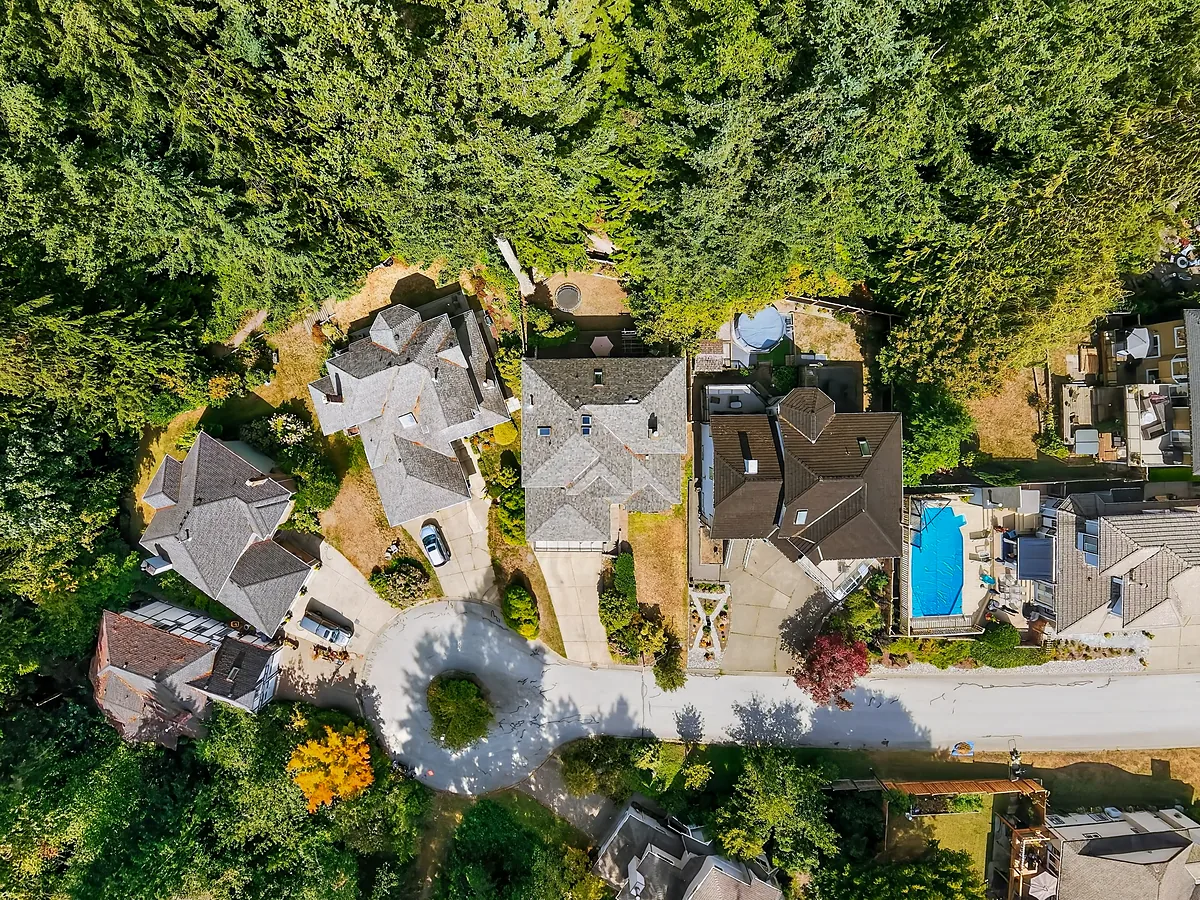 Overhead aerial view of homes and tree cover in the Lower Mainland