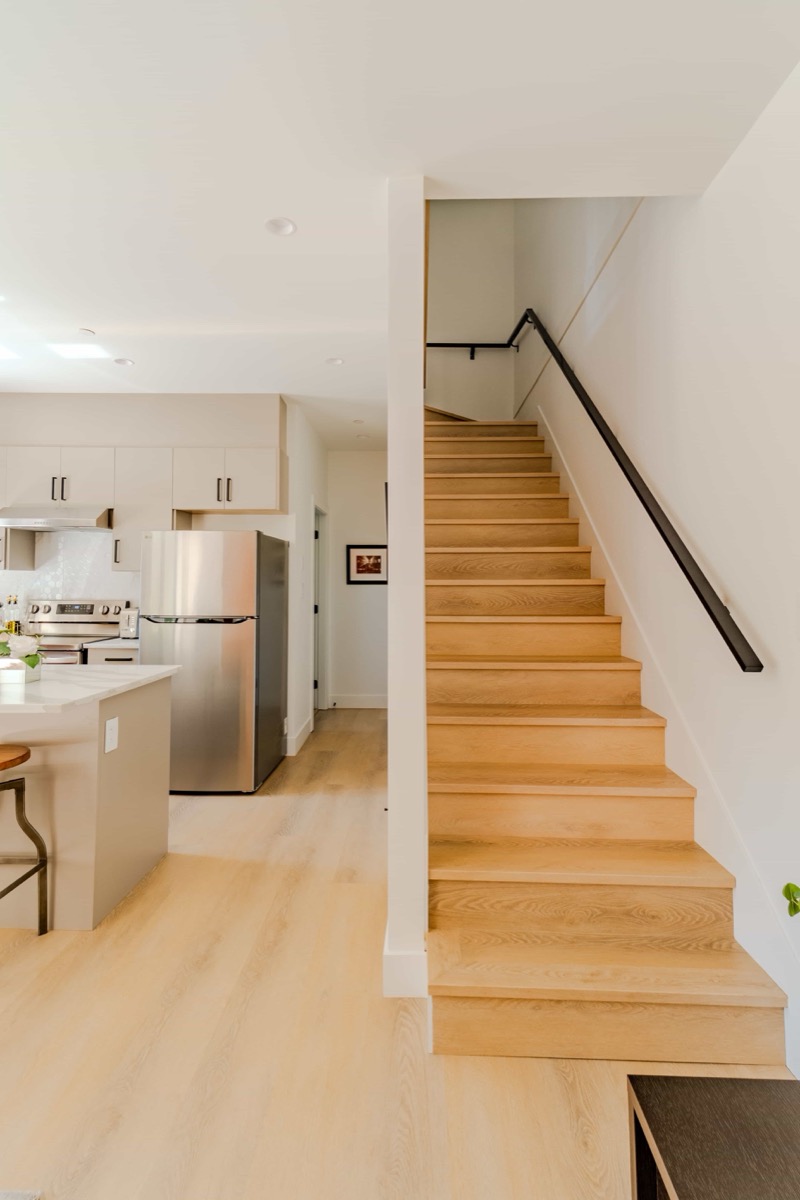 Open-plan kitchen and staircase documented for a floor plan