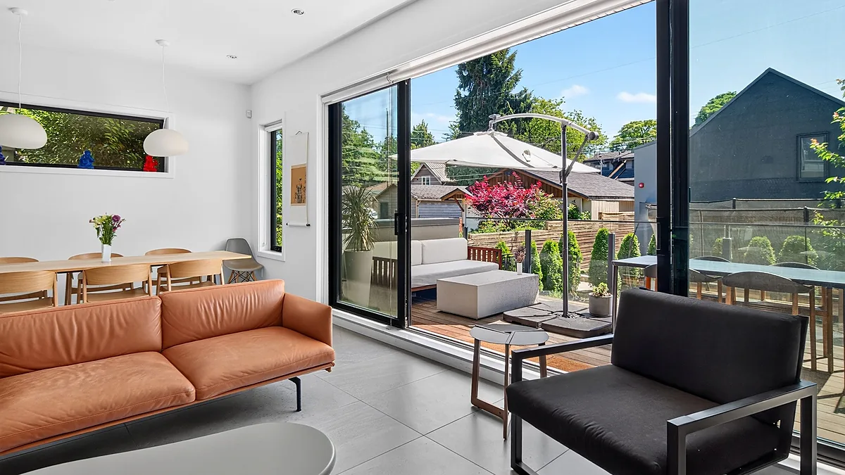 Living room opening onto a garden patio, 262 West 19th Ave, Vancouver