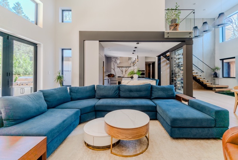 Grand Vancouver luxury home living room with double-height ceilings, custom millwork, and designer furnishings — premium real estate photography package