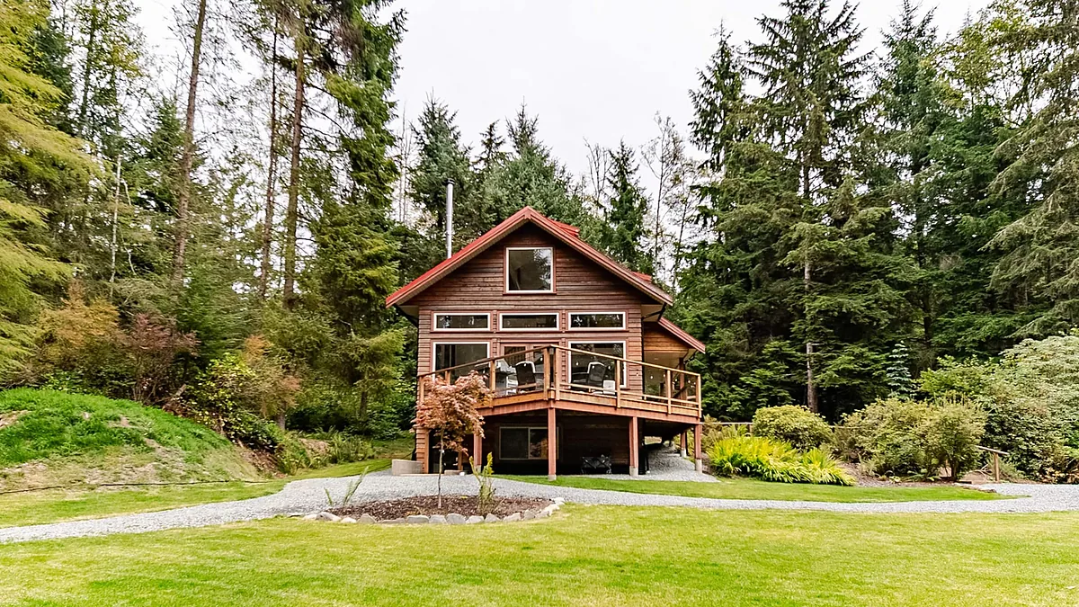 Cedar cabin exterior, opening frame of a listing video