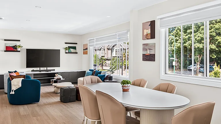 Open-plan living and dining frame from a listing video